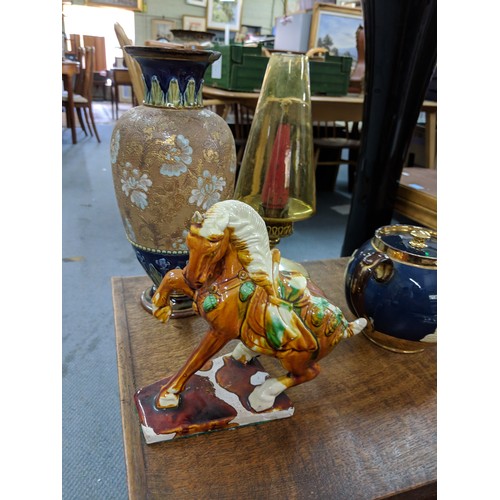 48 - A mixed lot to include silver plated cutlery, a Doulton Lambeth vase, a large carved tray, a teapot ... 