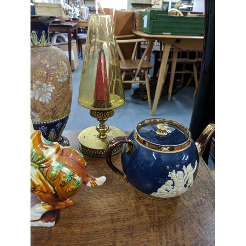 48 - A mixed lot to include silver plated cutlery, a Doulton Lambeth vase, a large carved tray, a teapot ... 