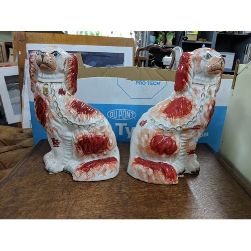 48A - Two Staffordshire pottery model dogs along with two beer steins depicting traditional scenes
Locatio... 