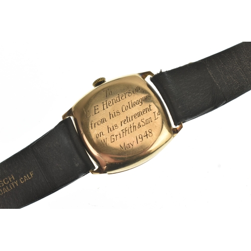 15 - An early/mid 20th century 9ct gold gents mid-size manual wind wristwatch, having a silvered dial wit... 