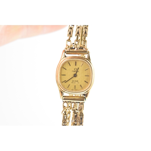 16 - An Omega De Ville 18ct gold and gold plated, ladies manual wind wristwatch, the gold plated case hou... 
