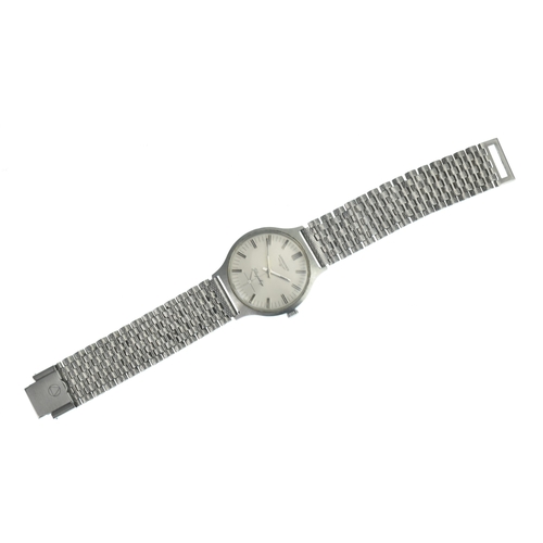 18 - A Longines Flagship, manual wind, gents, stainless steel wristwatch, the silvered dial having baton ... 