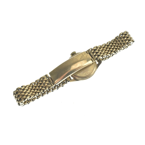 21 - An Omega 9ct gold, ladies, manual wind wristwatch, having a silvered dial with gilt baton markers, f... 