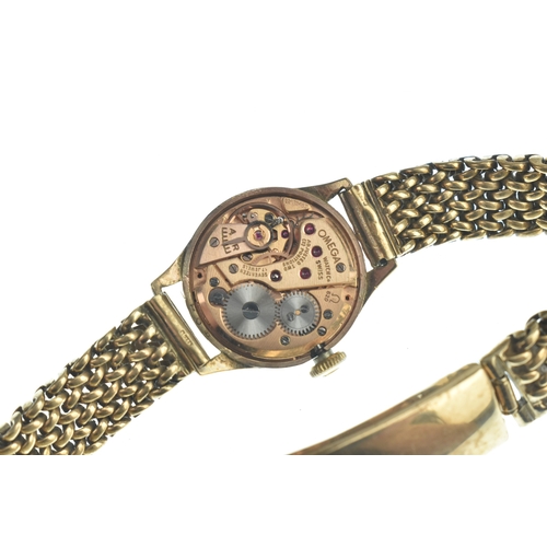 21 - An Omega 9ct gold, ladies, manual wind wristwatch, having a silvered dial with gilt baton markers, f... 