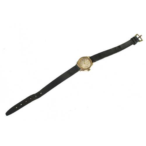 22 - A Tudor 9ct gold ladies manual wind wristwatch, the silvered dial having gilt baton markers, on a la... 