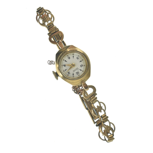 23 - An Everite 9ct gold ladies manual wind wristwatch, the dial having baton markers and Arabic numerals... 