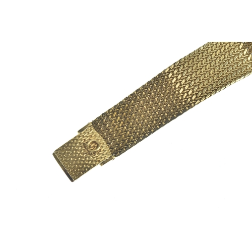24 - An Omega 9ct gold, gents, quartz wristwatch, the gilt dial having baton markers, the case back numbe... 