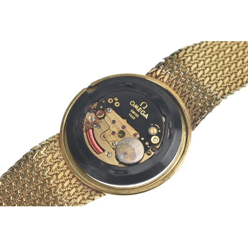 24 - An Omega 9ct gold, gents, quartz wristwatch, the gilt dial having baton markers, the case back numbe... 