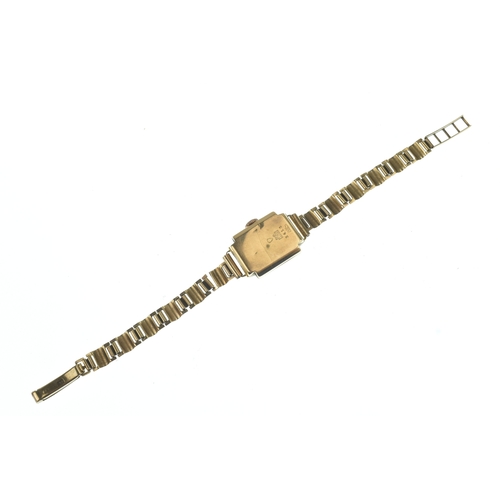 31 - A Titus 18ct gold ladies manual wind wristwatch, having a square silvered dial with Arabic numerals ... 
