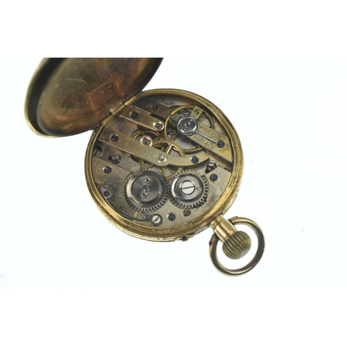 36 - A circa 1900 18ct gold ladies fob watch, the silvered dial having Roman numerals, floral engraved ca... 