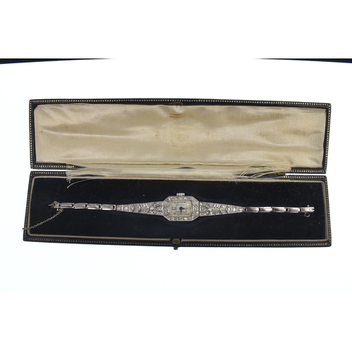 37 - An Art Deco ladies, diamond set, platinum, manual wind cocktail watch, the square dial having Arabic... 