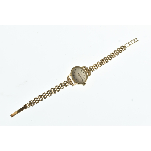 52 - A Tissot 9ct gold ladies manual wind wristwatch, the oval silvered dial having gilt baton markers, f... 