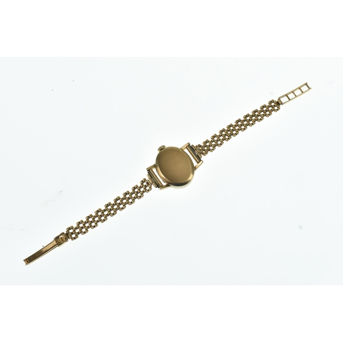 52 - A Tissot 9ct gold ladies manual wind wristwatch, the oval silvered dial having gilt baton markers, f... 