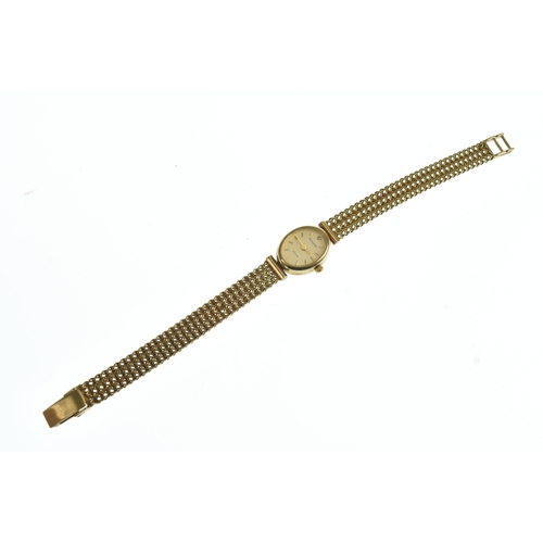 7 - An Accurist 9ct gold ladies quartz wristwatch, the oval dial having baton markers and diamond set as... 