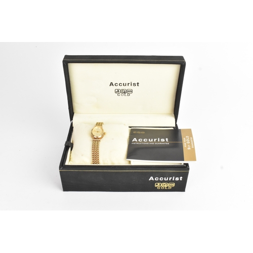 7 - An Accurist 9ct gold ladies quartz wristwatch, the oval dial having baton markers and diamond set as... 