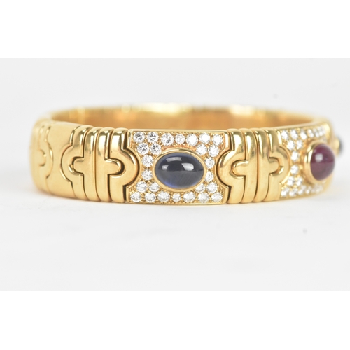 1 - A Bulgari ‘Parentesi’ 18ct gold, diamond, ruby and sapphire bracelet, of articulated geometric desig... 
