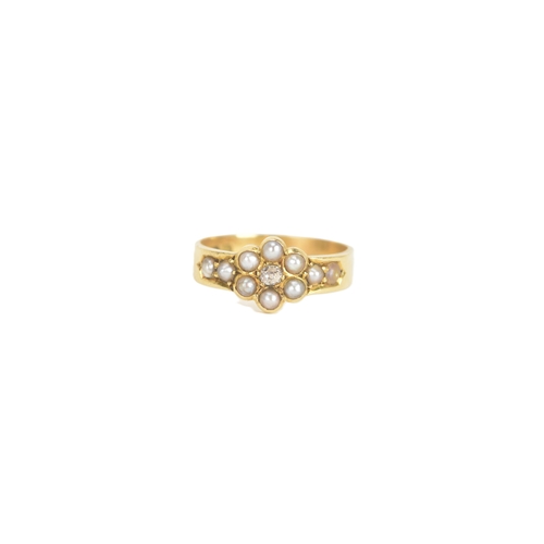 10 - A late Victorian diamond and seed pearl 18ct gold ring, the old cut diamond in a six claw setting me... 