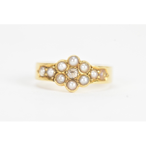 10 - A late Victorian diamond and seed pearl 18ct gold ring, the old cut diamond in a six claw setting me... 