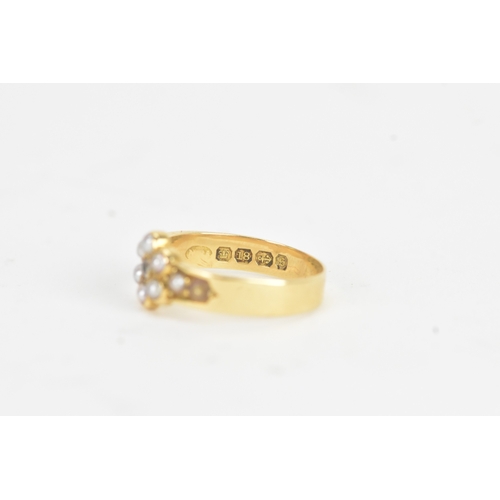 10 - A late Victorian diamond and seed pearl 18ct gold ring, the old cut diamond in a six claw setting me... 