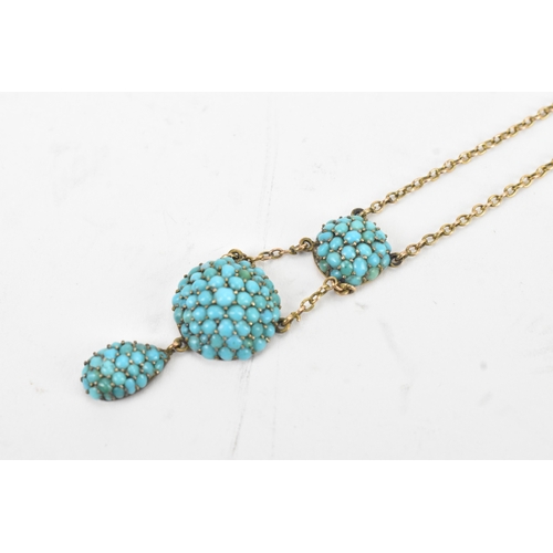 11 - A Victorian turquoise pave set 9ct gold necklace, the chain suspending three graduated domed cluster... 