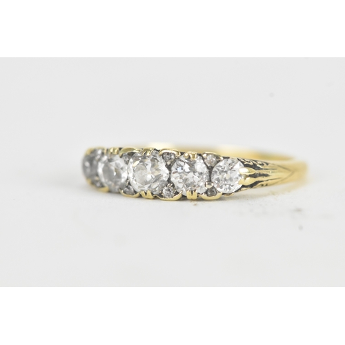 14 - A late 19th/early 20th century diamond yellow gold engagement ring, unmarked, set with five graduate... 