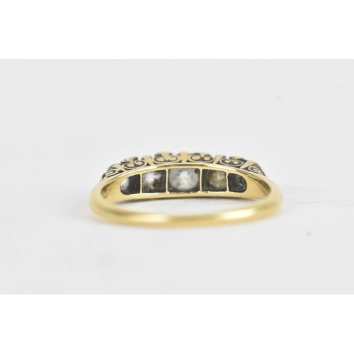 14 - A late 19th/early 20th century diamond yellow gold engagement ring, unmarked, set with five graduate... 