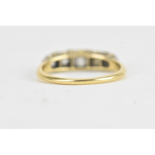 14 - A late 19th/early 20th century diamond yellow gold engagement ring, unmarked, set with five graduate... 
