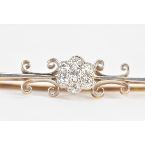 15 - An early 20th century diamond yellow and white metal bar brooch, unmarked, the central cluster set w... 