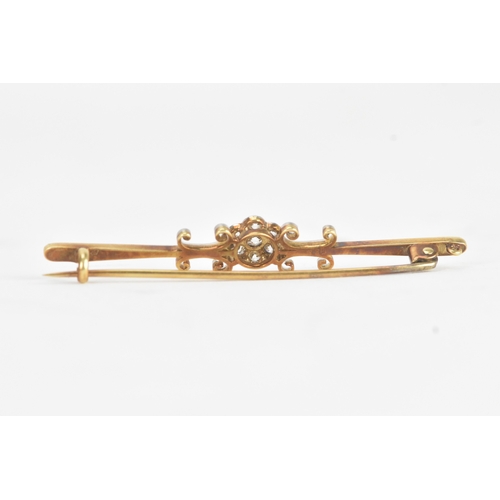 15 - An early 20th century diamond yellow and white metal bar brooch, unmarked, the central cluster set w... 