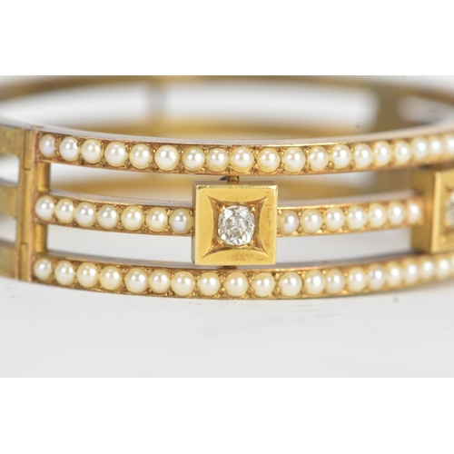 16 - A late Victorian seed pearl and diamond yellow gold hinged bangle, unmarked, of openwork triple-band... 
