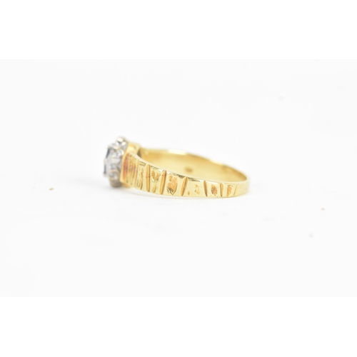 20 - A sapphire and diamond 18ct gold ring, the central claw setting sapphire surrounded by small diamond... 