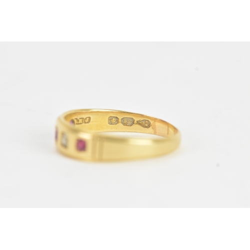 24 - A ruby and diamond 18ct gold ring, set with three rubies and one diamond (one diamond missing), the ... 