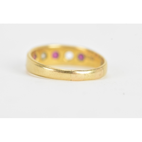 24 - A ruby and diamond 18ct gold ring, set with three rubies and one diamond (one diamond missing), the ... 