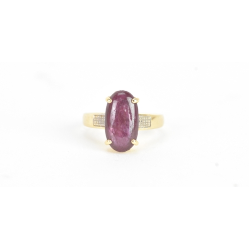 25 - An 18ct gold dress ring, set with a large oval cabochon in a four claw setting, measuring approximat... 