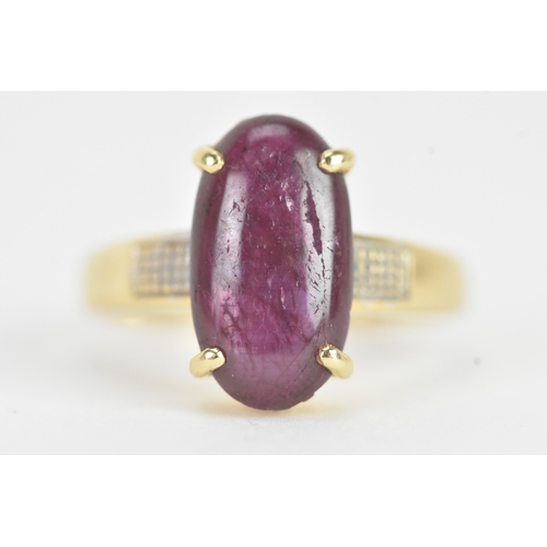 25 - An 18ct gold dress ring, set with a large oval cabochon in a four claw setting, measuring approximat... 
