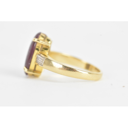 25 - An 18ct gold dress ring, set with a large oval cabochon in a four claw setting, measuring approximat... 
