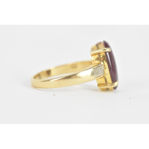 25 - An 18ct gold dress ring, set with a large oval cabochon in a four claw setting, measuring approximat... 