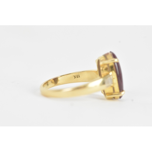 25 - An 18ct gold dress ring, set with a large oval cabochon in a four claw setting, measuring approximat... 