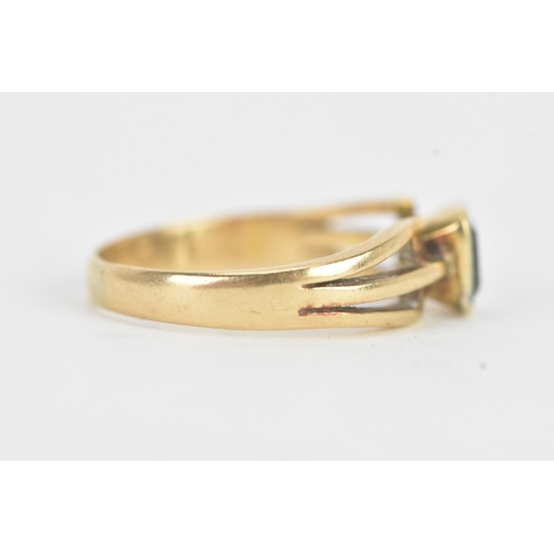26 - An emerald 18ct yellow gold dress ring, the flush set emerald measuring approximately 4.2mm x 5mm, t... 