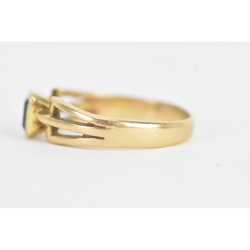 26 - An emerald 18ct yellow gold dress ring, the flush set emerald measuring approximately 4.2mm x 5mm, t... 