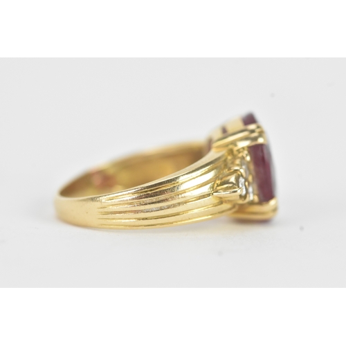 28 - A ruby and diamond 18ct gold ring, the oval ruby in a four claw setting measuring approximately 11.2... 