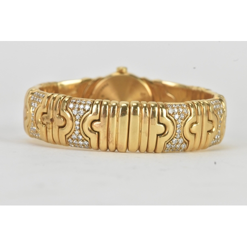 3 - A Bulgari ‘Parentesi’ 18ct gold and diamond lady’s wristwatch, the circular champagne dial with gilt... 