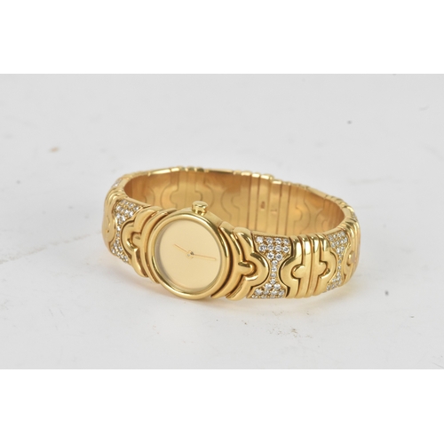 3 - A Bulgari ‘Parentesi’ 18ct gold and diamond lady’s wristwatch, the circular champagne dial with gilt... 