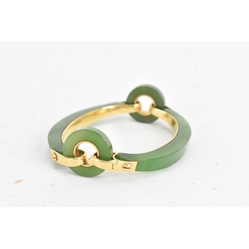 30 - A jade 18ct gold articulated bangle, composed of two curved and two circular polished jade sections ... 