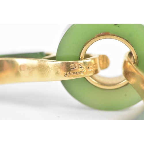 30 - A jade 18ct gold articulated bangle, composed of two curved and two circular polished jade sections ... 