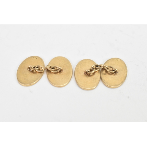 31 - A pair of 14ct yellow gold cufflinks, in oval form, having floral engraved decoration. 14mm x 11.7mm... 