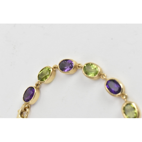 32 - A 9ct yellow gold bracelet featuring alternating oval-cut amethyst and peridots in a rub over settin... 