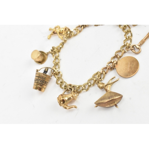 38 - A 9ct yellow gold charm bracelet having a heart shaped padlock clasp, with eight 9ct yellow gold cha... 