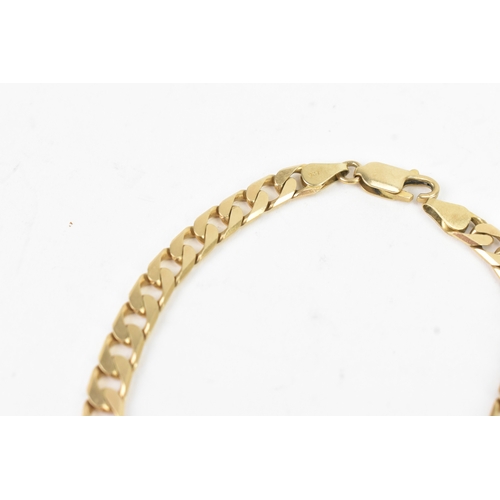 39 - A 9ct yellow gold flat link bracelet having a lobster claw clasp, stamped 375, 21ckm long, weight 12... 