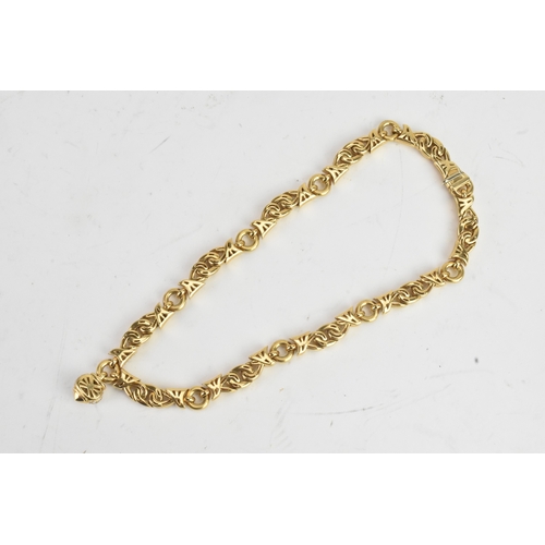 4 - A Bulgari ‘Doppio Cuore’ 18ct gold and diamond necklace, designed as a series of polished interwoven... 